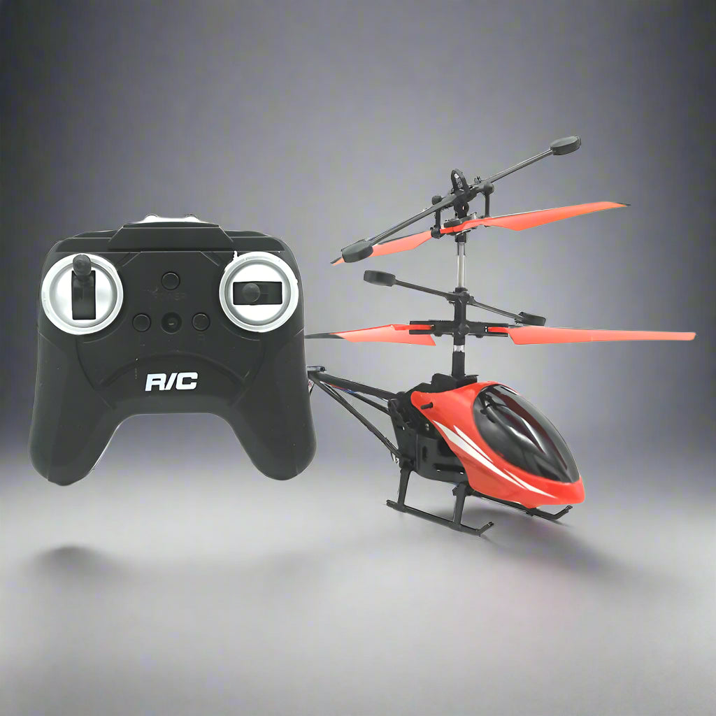 Black and red RC helicopter with remote control on a white background