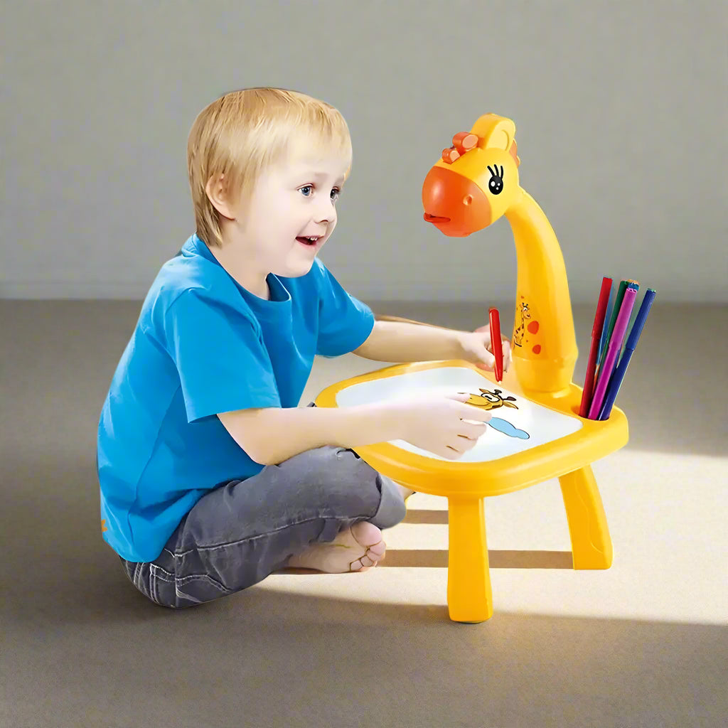 Child using a giraffe-shaped drawing desk with colored pencils on a white background